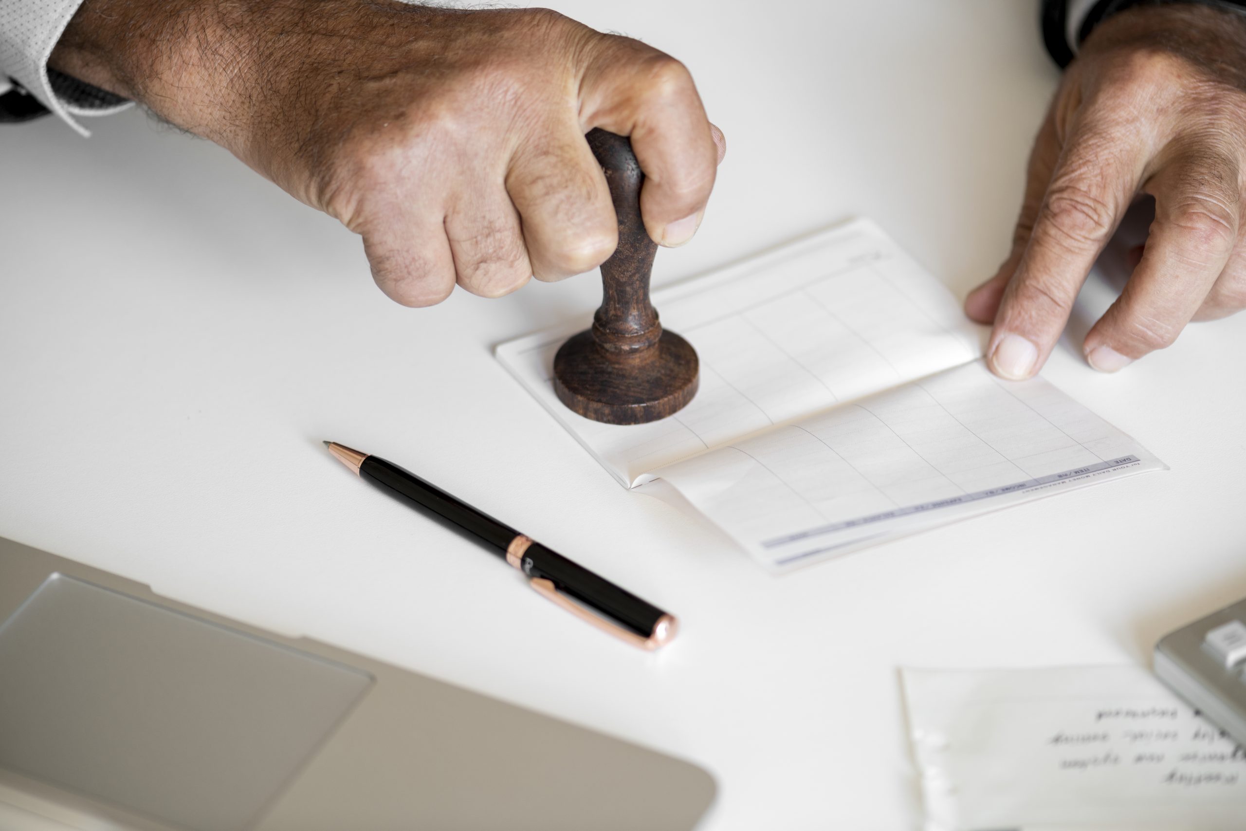 people checking bankbook isolated white table scaled